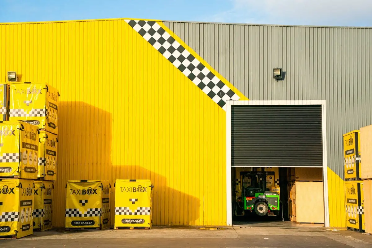 Green forklift in storage unit